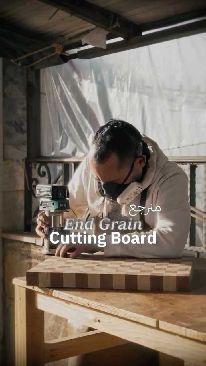 Frame from an e-commerce advertisement: a woodworker routing an end grain cutting board